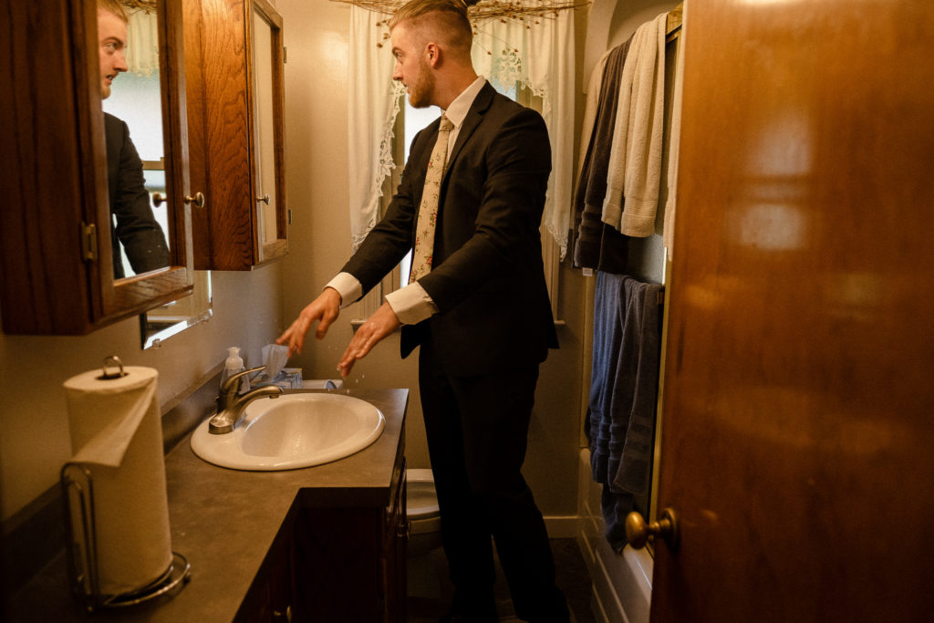 Groom getting ready at his family home in Cleveland Ohio.
