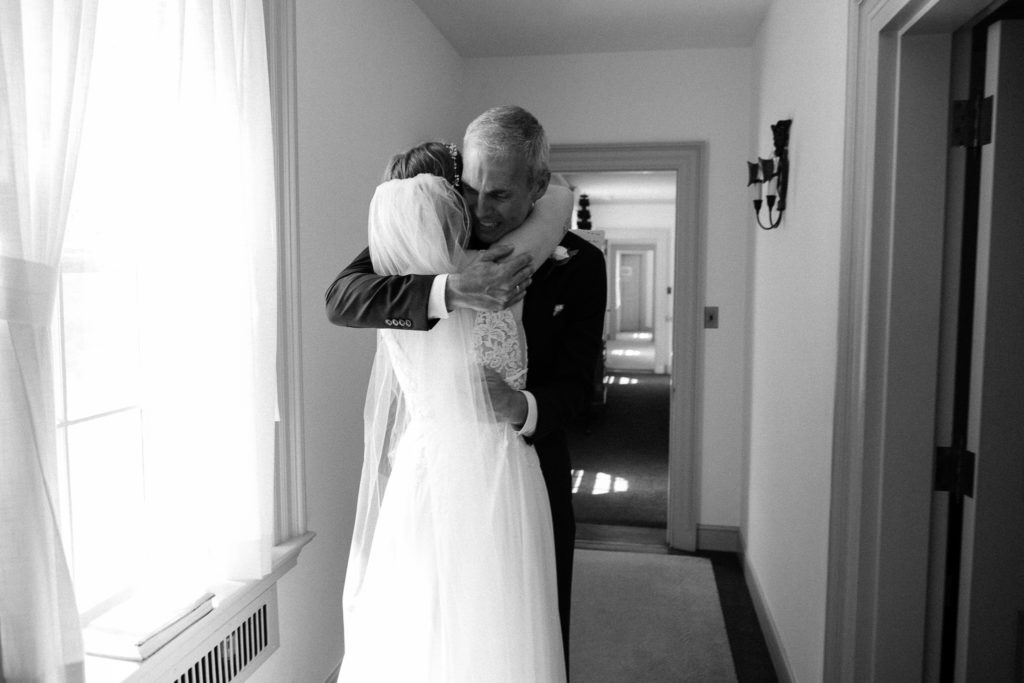 Bride sharing a first look with her father before the wedding at the Lantern Court Estate at Holden Arboretum in Cleveland Ohio.