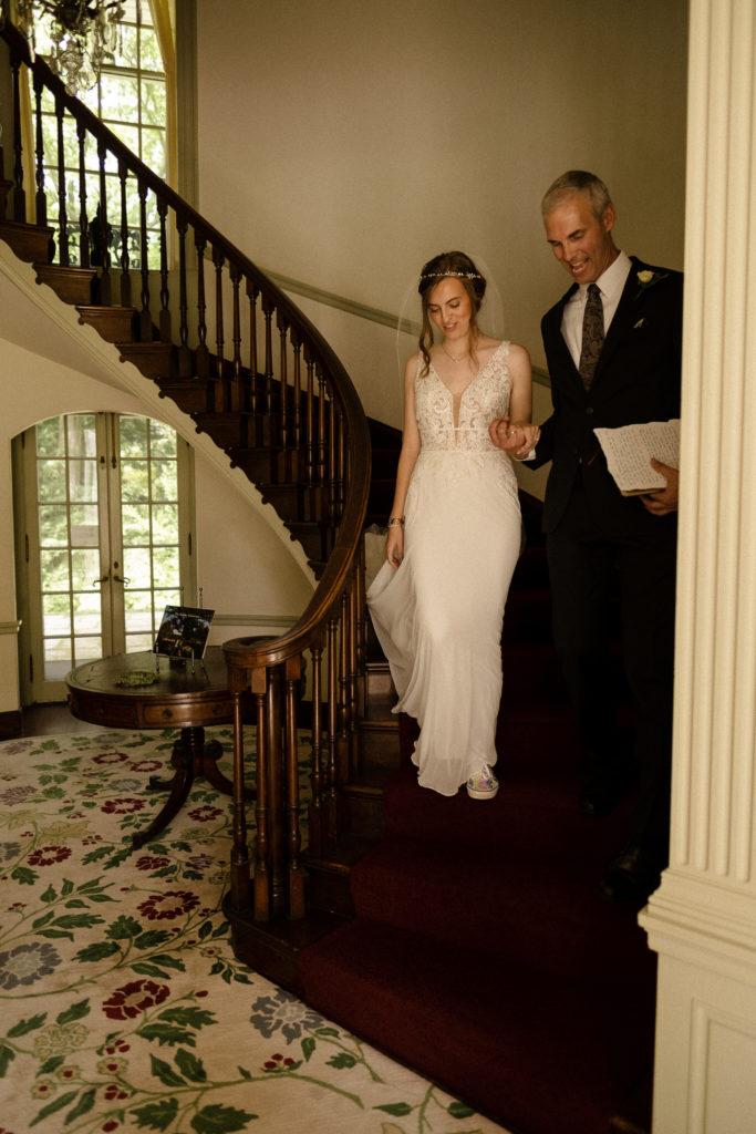 Bride sharing a first look with her father before the wedding at the Lantern Court Estate at Holden Arboretum in Cleveland Ohio.