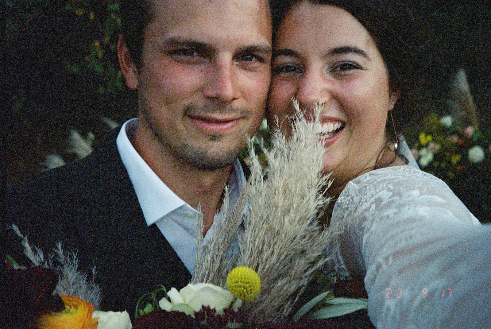 35mm Film Selfie of newly married couple at their backyard dinner party wedding in Iowa