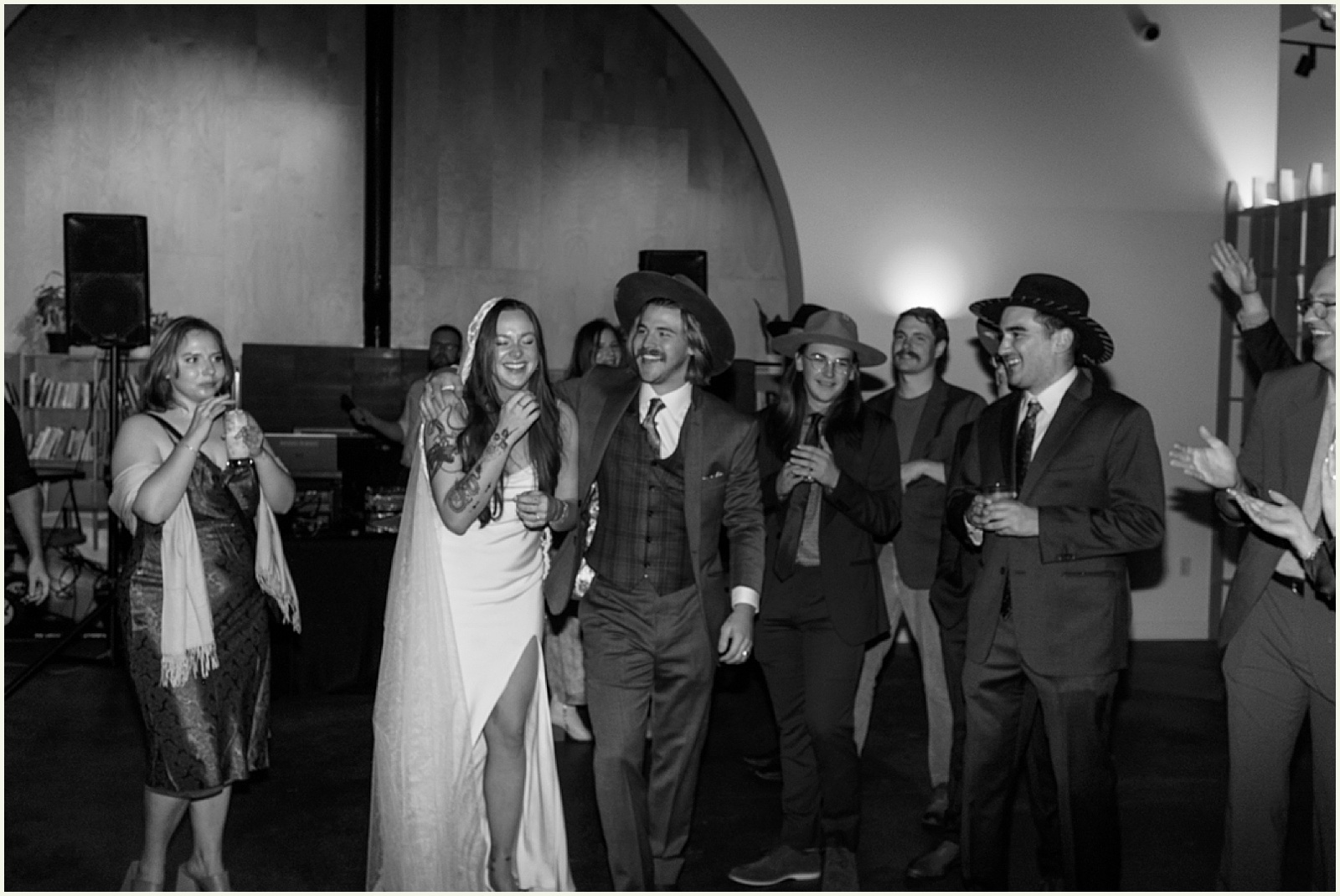 A bride and groom laugh during a toast at a brewery wedding venue in Minneapolis.