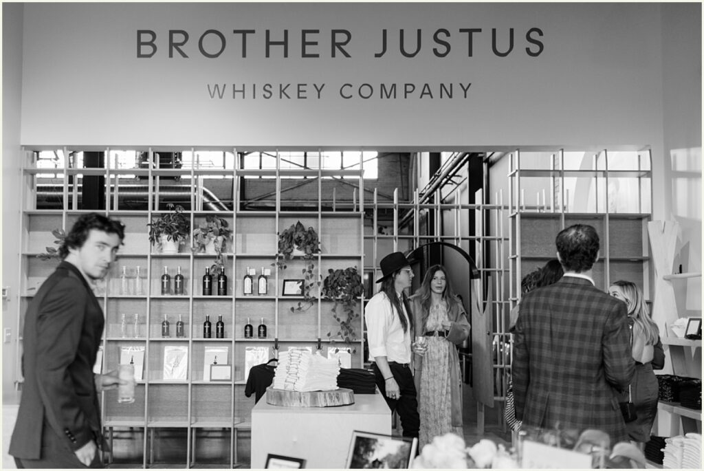 Wedding guests walk through the Brother Justus shop.