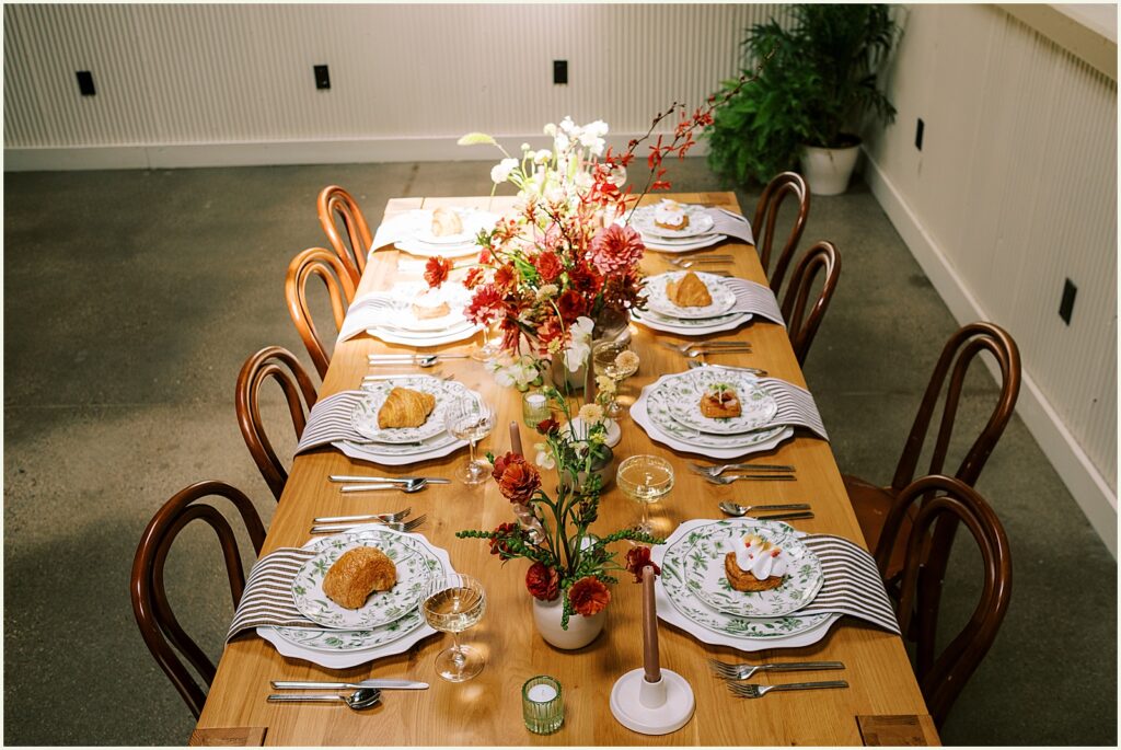 Pastries and flowers decorate a long reception table for a wedding at Diane's Place