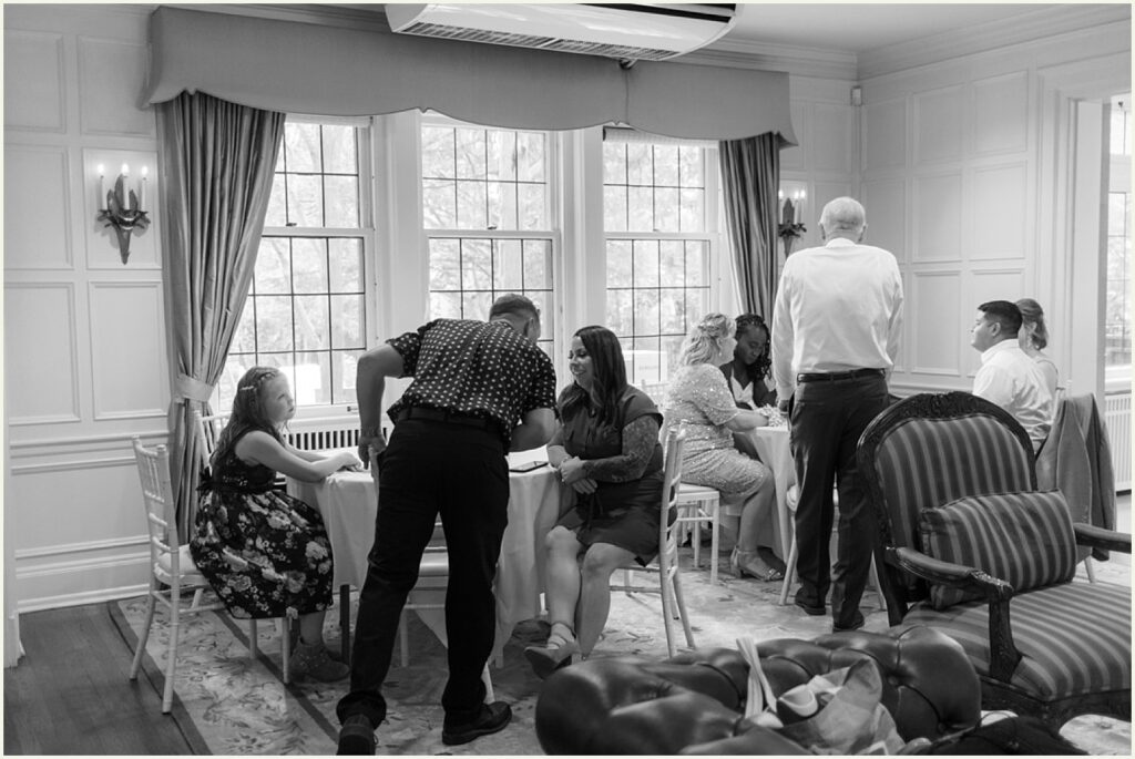Wedding guests gather in a sitting room at a St. Paul wedding venue.