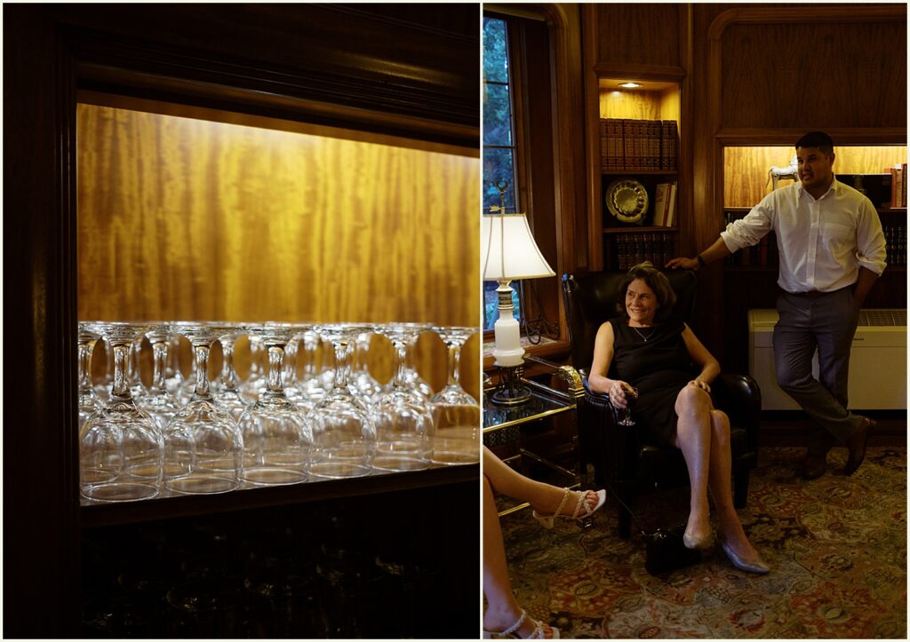 Empty wine glasses line a backlit shelf.